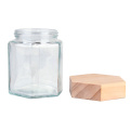 Custom 70ml 180ml 280ml 380ml wide mouth food grade hexagonal glass honey jar with wooden lid